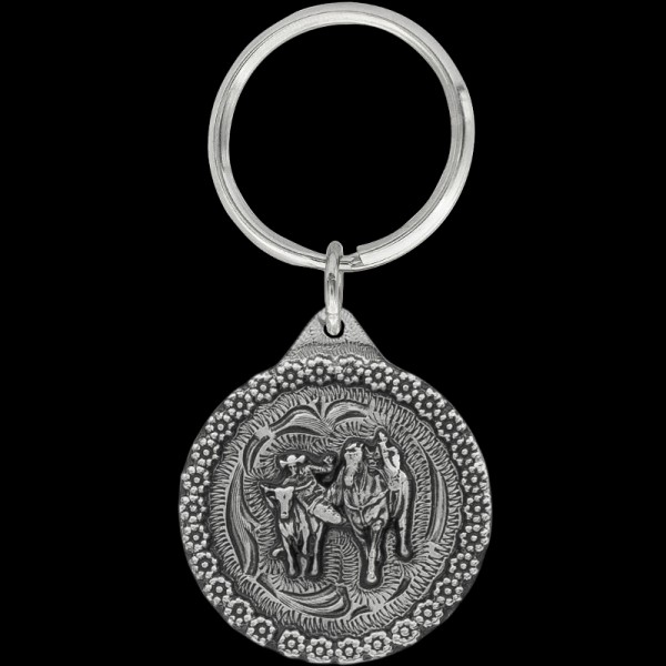 Steer Wrestling Keychain, It’s rodeo time! Our Steer Wrestling keychain includes a detailed berry border, a 3D figure, and a key ring attachment. Each silver keychain is built